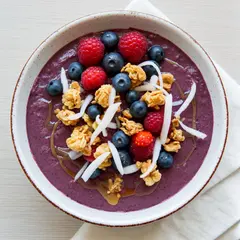 Bria FIBO — A colorful acai bowl topped with fresh berries, gr