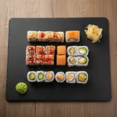 FLUX.2 [dev] — A perfectly plated sushi omakase on a black slate 