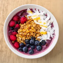 FLUX.2 [dev] — A colorful acai bowl topped with fresh berries, gr