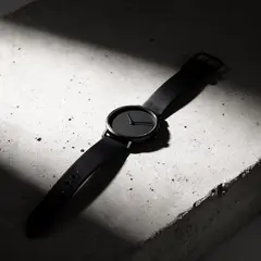 FLUX.2 [dev] — A minimalist wristwatch with a black leather strap