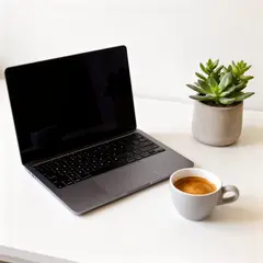 FLUX.2 [dev] — A sleek laptop on a clean white desk with a potted
