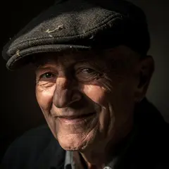 FLUX.2 [pro] — An elderly man with a weathered face and kind smil