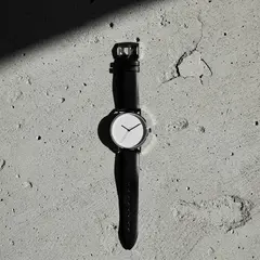 FLUX.2 [pro] — A minimalist wristwatch with a black leather strap