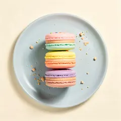 FLUX.2 [pro] — A stack of colorful macarons on a pastel blue plat