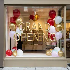 FLUX.2 [pro] — A storefront window with GRAND OPENING painted in 