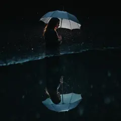 FLUX Pro 1.1 — A woman holding an umbrella in the rain, reflected