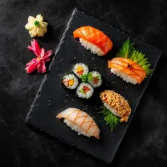 FLUX Pro 1.1 — A perfectly plated sushi omakase on a black slate 