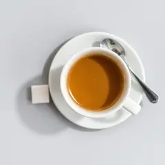 FLUX.1 [schnell] — A cup of coffee on a saucer, with a spoon to the r