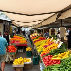 FLUX.1 [schnell] — A busy farmer's market scene with at least six dif