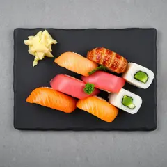 FLUX.1 [schnell] — A perfectly plated sushi omakase on a black slate 