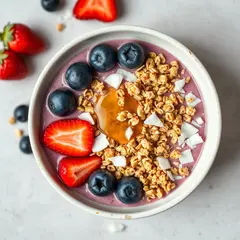 FLUX.1 [schnell] — A colorful acai bowl topped with fresh berries, gr