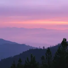 FLUX.1 [schnell] — A misty mountain range at sunrise, layers of purpl