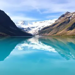 FLUX.1 [schnell] — A turquoise glacial lake surrounded by snow-capped