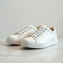 FLUX.1 [schnell] — A pair of white leather sneakers on a marble count