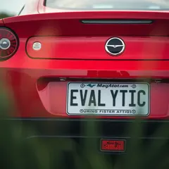 FLUX.1 [schnell] — A license plate reading EVALYTIC on the back of a 