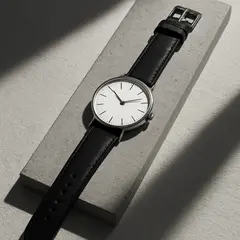 GPT Image 1 Mini — A minimalist wristwatch with a black leather strap