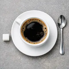 GPT Image 1.5 — A cup of coffee on a saucer, with a spoon to the r