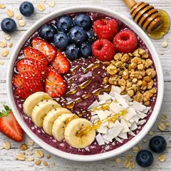 GPT Image 1.5 — A colorful acai bowl topped with fresh berries, gr