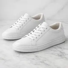 GPT Image 1.5 — A pair of white leather sneakers on a marble count