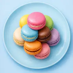 GPT Image 1.5 — A stack of colorful macarons on a pastel blue plat