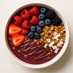 GPT Image 1 — A colorful acai bowl topped with fresh berries, gr