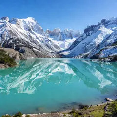 Grok Imagine — A turquoise glacial lake surrounded by snow-capped