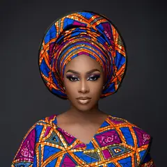 Grok Imagine — A woman with elaborate gele headwrap and bold eye 