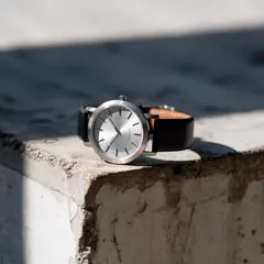 Ideogram V3 Turbo — A minimalist wristwatch with a black leather strap