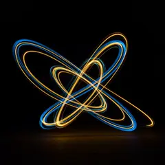 Imagen 3 — Intertwining ribbons of light in blue and gold aga