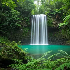 Imagen 3 — A waterfall cascading into a tropical pool surroun