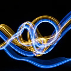 Imagen 4 Fast — Intertwining ribbons of light in blue and gold aga