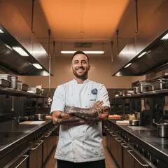 Imagen 4 Fast — A tattooed chef in a white coat, arms crossed, con