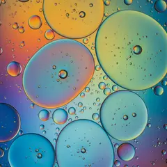 Imagen 4 Ultra — A macro photograph of oil droplets on water, iride