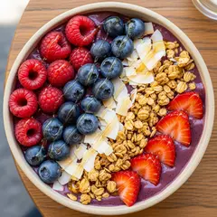 Imagen 4 — A colorful acai bowl topped with fresh berries, gr
