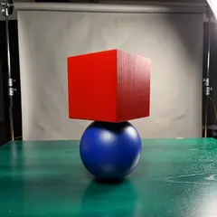 ImagineArt 1.5 — A red cube on top of a blue sphere, both sitting o