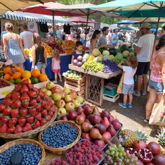 ImagineArt 1.5 — A busy farmer's market scene with at least six dif