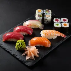 ImagineArt 1.5 — A perfectly plated sushi omakase on a black slate 