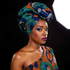 ImagineArt 1.5 — A woman with elaborate gele headwrap and bold eye 