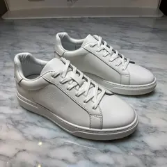 ImagineArt 1.5 — A pair of white leather sneakers on a marble count