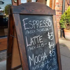 ImagineArt 1.5 — A hand-lettered chalkboard menu outside a coffee s