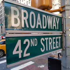 ImagineArt 1.5 — A street sign at the intersection of BROADWAY and 