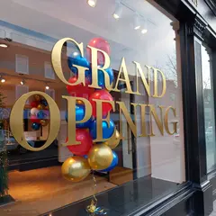 ImagineArt 1.5 — A storefront window with GRAND OPENING painted in 