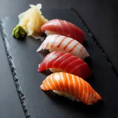 Luma Photon — A perfectly plated sushi omakase on a black slate 