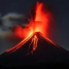 Luma Photon — A volcano erupting at night with lava flowing down