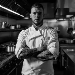 Luma Photon — A tattooed chef in a white coat, arms crossed, con