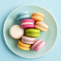 Luma Photon — A stack of colorful macarons on a pastel blue plat