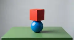 Gemini 3.1 Flash Image — A red cube on top of a blue sphere, both sitting o