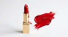Gemini 3.1 Flash Image — A tube of red lipstick standing upright, melting s
