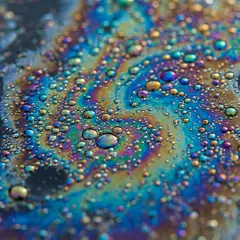 Gemini 3 Pro Image — A macro photograph of oil droplets on water, iride
