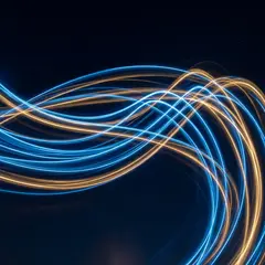 Gemini 3 Pro Image — Intertwining ribbons of light in blue and gold aga